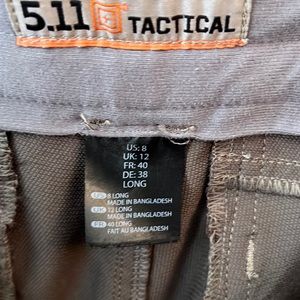 Brown 5.11 tactical pants with tear